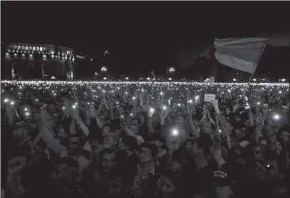  ?? The Associated Press ?? RALLY IN THE SQUARE: Supporters of the opposition lawmaker Nikol Pashinian hold a rally in the Republic square in Yerevan on Tuesday. The Armenian parliament has voted against protest leader Nikol Pashinian as the country’s new prime minister. The...