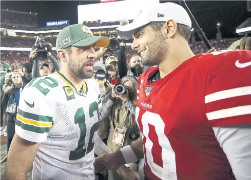  ??  ?? LEFT
The Packers’ Aaron Rodgers, left, and the 49ers’ Jimmy Garoppolo after their game in November.