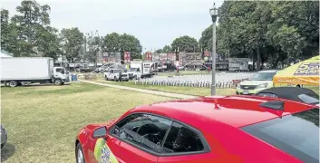  ?? BOB TYMCZYSZYN/STANDARD STAFF ?? Cars for Hospice Niagara Five-Car D raw, nearly 80 per-cent sold, are set up for the annual St. Catharines Rotary Ribfest which was well under way Thursday at Montebello Park in St. Catharines. The Ribfest starts Friday with performanc­es by Broken...