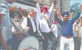  ??  ?? Family and friends celebratin­g Harjit Singh Sajjan’s victory in Canadian elections at his native village Bambeli in Hoshiarpur on Tuesday. HT PHOTO