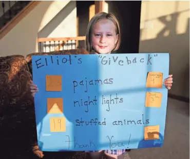  ?? RICK WOOD/MILWAUKEE JOURNAL SENTINEL ?? Elliot Koenig, 8, adopts a charity in lieu of receiving birthday gifts for herself. At her parties, she asks friends to support a charity by giving gifts to kids in need.