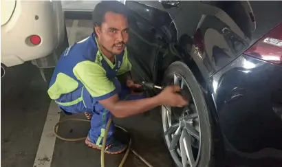  ?? Supplied photo ?? Mohammed Mashin Ali has been washing cars at malls across Dubai ever since he came to the country nine years ago. — Protection is priority