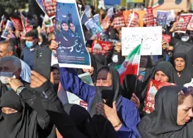  ?? (AFP) ?? Mourners take part in a funeral for victims of a mass shooting at a key shrine earlier in the week that killed more than a dozen worshipper­s, in Iran’s southern city of Shiraz, on Saturday