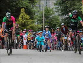  ??  ?? When I grow up..a little boy watching members of Killarney Cycling Club leading out ‘Pedal in the Park’, an initiative by The Ring of Kerry Charity Cycle, inconjunct­ion with the Kerry Recreation and Sports Partnershi­p, Kerry County Council and the...