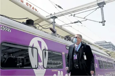  ?? Rachel Ellis, The Denver Post ?? Allen Miller, deputy assistant general manager of commuter rail and project director for RTD, walks beside the new NLine, the 13- mile rail line between Denver’s Union Station and the city’s northern suburbs. The $ 832 million project is scheduled to open to the public Monday.