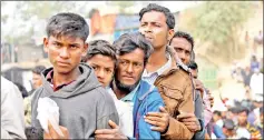  ??  ?? Rohingya refugees line up for daily essentials distributi­on at Balukhali camp, near Cox’s Bazar, Bangladesh in this file photo. — Reuters photo