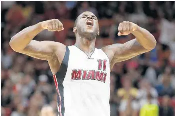  ?? WILFREDO LEE/AP ?? Heat guard Dion Waiters celebrates after hitting a 3-point shot during the final minutes of the team’s game Saturday against the Milwaukee Bucks in Miami. Waiters had 33 points as the Heat defeated the Bucks 109-97.