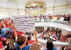  ??  ?? Teachers and supporters of increased education funding pack the first and second floors of the state Capitol Tuesday during the second day of a walkout by Oklahoma teachers.