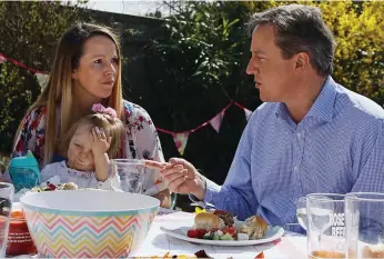  ??  ?? Bored now! This little girl’s pose says it all as Mr Cameron meets voters yesterday