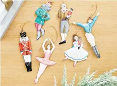  ?? BALLARD DESIGNS ?? Ballard Designs’ Nutcracker collection includes handmade, hand-painted ornaments based on the iconic holiday ballet.