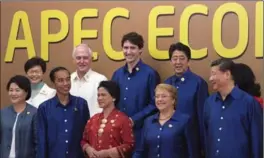  ?? ADRIAN WYLD, THE CANADIAN PRESS ?? Prime Minister Justin Trudeau joined other leaders for a photo at APEC summit in Danang, Vietnam, Friday, just hours before a Trans-Pacific Partnershi­p trade deal was finalized.