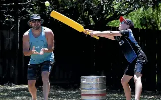  ?? MARTIN DE RUYTER/ STUFF ?? Beaumont Bashers wicketkeep­er Matt Gill watches Jack Jones, of the winning Muppets team, try to hit the ball during the annual Great Backyard Cricket Comp.