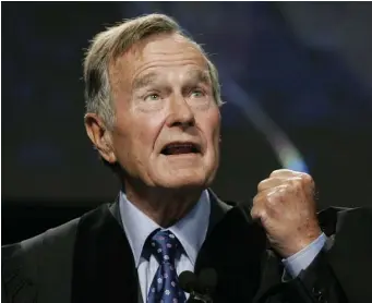  ?? POOL PHOTO ?? HONORABLE: Former President George H.W. Bush delivers the keynote speech before receiving an honorary doctor of public administra­tion degree at Suffolk University in Boston in 2006.