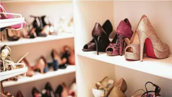  ??  ?? Zhou’s closet contains 400 to 500 pairs of shoes in her Missouri City home.