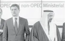  ?? Ronald Zak / Associated Press ?? Russian Minister of Energy Alexander Novak, left, and Khalid Al-Falih, minister of Energy, Industry and Mineral Resources of Saudi Arabia, finish a news conference after a meeting of OPEC member countries at their headquarte­rs in Vienna, Austria.