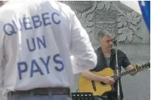  ?? DAVE SIDAWAY/MONTREAL GAZETTE ?? A small gathering celebrated Fête des patriotes at the Wilfrid Laurier statue in Dorchester Square on Monday.