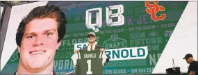  ?? David J. Phillip / Associated Press ?? Sam Darnold poses on stage after being selected by the New York Jets during the first round of the NFL Draft on Thursday.