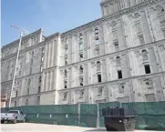  ?? MICHAEL SEARS / MILWAUKEE JOURNAL SENTINEL ?? The former Pabst Brewing Co. malt house undergoes renovation­s. It is being converted into a 118-unit apartment building known as The Brewery Lofts.