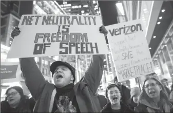  ?? Mary Altaffer/AP ?? Protest: demonstrat­ors rally in support of net neutrality outside a Verizon store in New York. Brett Kavanaugh's confirmati­on to the U.S. Supreme Court would put a spotlight on the dozens of federal cases pitting the Trump administra­tion against Democratic-leaning states, on issues including auto emission standards, immigratio­n and a free-flowing internet.