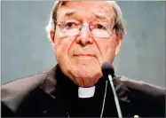  ?? GREGORIO BORGIA ?? In this June 29, file photo, Cardinal George Pell meets the media, at the Vatican. Cardinal George Pell, the most senior Catholic official to face sex offense charges, was jeered by protesters as he made a court appearance on Friday in his native...