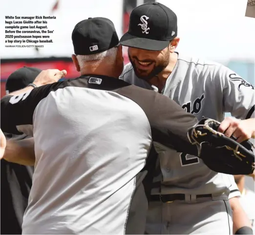  ?? HANNAH FOSLIEN/GETTY IMAGES ?? White Sox manager Rick Renteria hugs Lucas Giolito after his complete game last August. Before the coronaviru­s, the Sox’ 2020 postseason hopes were a top story in Chicago baseball.