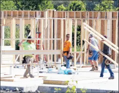  ??  ?? Work continues as a groundbrea­king ceremony for a 75-unit apartment complex for veterans takes place. The building that is already under constructi­on is located at 7930 Iowa St. in Hobart on Thursday.