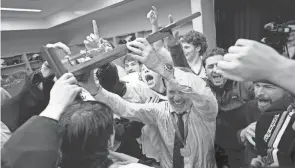  ?? ?? Olentangy Liberty coach Kevin Alexander celebrates the state title with his players.