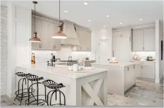  ??  ?? The kitchen features extensive counter space, a striking tile backsplash and charming farmhouse style sink.