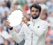  ?? AFP ?? Italy’s Matteo Berrettini holds the runner-up trophy last year.