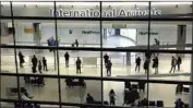  ?? Matt Dunham Associated Press ?? BRITAIN’S rule change on quarantine takes effect Monday. Above, travelers at Heathrow Airport.