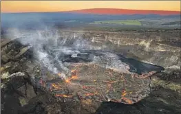  ?? U.S. Geological Survey ?? KILAUEA, one of the world’s most active volcanoes, began erupting again Jan. 5 after scientists detected a glow within Halemaumau Crater, seen here a day later.