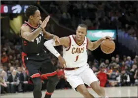  ?? TONY DEJAK— ASSOCIATED PRESS ?? In this April 3 file photo, the Cavaliers’ Rodney Hood (1) drives against the Raptors’ DeMar DeRozan (10) in Cleveland.