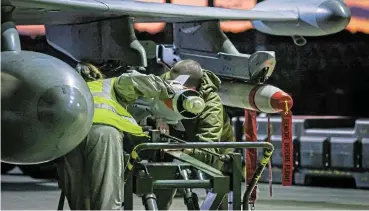  ?? /Reuters ?? Backlash: RAF weapon technician­s prepare an RAF Typhoon FRG4s aircraft on Saturday. RAF Typhoon aircraft have conducted another set of strikes against Houthi military facilities in Yemen involved in their attacks on internatio­nal shipping in the Red Sea.