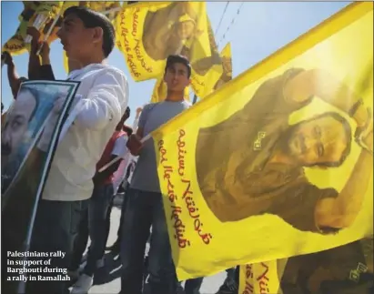  ?? PHOTO: GETTY IMAGES ?? Palestinia­ns rally in support of Barghouti during a rally in Ramallah