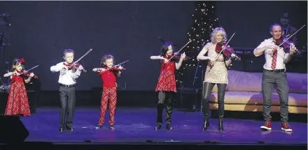  ??  ?? “It’s turned out to be a beautiful story that we never could have dreamed of,” fiddler and folk music star Natalie MacMaster says of touring and performing with her family.