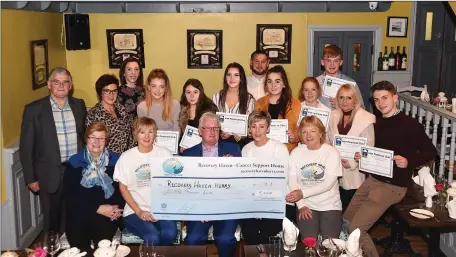 ??  ?? Bill Tobin (seated centre) presenting the proceeds of a recent Parachute Jump €9000 to Recovery Haven (front Maureen O’Brien, Caroline Foley, Miranda Ahern, Catherine O’Donoghue (back from left) Dermot Crowley, Martha Fleming, Melissa MacBeth, Lucy O’Donnell, Laura Kelly, Shane Griffin, Shannon Tangney, Lucy Knight, Sean Houlihan, Selina Spenser McKenna, and Fionn Oliver at Nick’s Restaurant, Killorglin.Photo by Michelle Cooper Galvin
