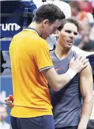  ?? AP ?? Argentina’s Juan Martin del Potro (left) consoles Spain’s Rafael Nadal after the latter retired from their semi-final match at the U.S. Open tennis tournament yesterday.