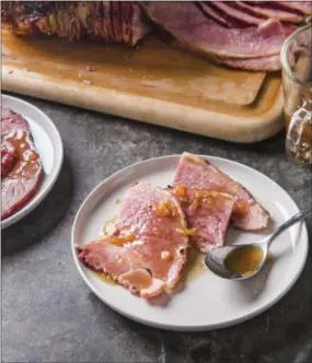  ?? JOE KELLER /AMERICA’S TEST KITCHEN VIA ASSOCIATED PRESS ?? This undated photo provided by America’s Test Kitchen shows glazed spiral-sliced ham in Brookline, Mass. sugar 1 teaspoon pepper