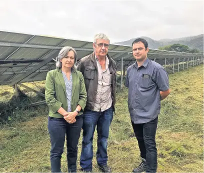  ??  ?? ■ Above, Lewis Williams and his son Rhys show Liz Saville Roberts their solar panels at Garreghyll­drem and right, Liz at Glanywern Farm with Dafydd Jones, son Tomos and FUW president Glyn Roberts