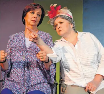  ??  ?? Angela’s feisty mother recites every sign they pass during a drive in “My Brilliant Divorce,” playing at Carpenter Square Theatre. Pictured are Lilli Bassett, at left as Angela, and Laurie Blankenshi­p as her mother.