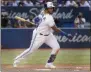  ?? FRED THORNHILL - THE ASSOCIATED PRESS ?? Toronto Blue Jays’ Vladimir Guerrero Jr. hits a triple to score two runs during the seventh inning of a baseball game against the New York Yankees, Saturday, Aug. 10, 2019 in Toronto.