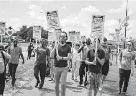  ?? Glen Stubbe / Associated Press ?? This year, some used the high-profile event as a way to garner attention for their protests against Amazon. Workers, supporters and activists picketed outside the Amazon fulfillmen­t center in Shakopee, Minn.