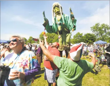  ?? Brian A. Pounds / Hearst Connecticu­t Media ?? The Alpaca Gnomes, known for wearing pointy gnome hats, will perform July 11 on the Huntington Green and July 20 on Canal Street in downtown Shelton.