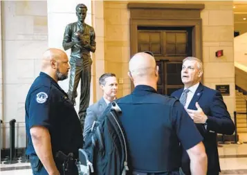  ?? STEFANI REYNOLDS NYT FILE ?? Rep. Barry Loudermilk speaks to police officers at the Capitol on May 14, 2021. A man who toured the Capitol complex with Loudermilk the day before the Jan. 6, 2021, attack was among those who marched on the building.