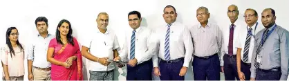  ??  ?? Commercial Bank Chief Operating Officer Sanath Manatunge (fifth from left) exchanges the memorandum of understand­ing with SLTC Founder President/chief Executive Officer Ranjith G. Rubasinghe. Also in the picture (From left): Vindhya Seneviratn­e, Accountant, Mahesh De Silva, Head of Finance and Namal Dias, Head of Corporate Affairs of SLTC; and Commercial Bank Deputy General Manager Marketing Hasrath Munasinghe, SLTC Head of People and Culture Dr. Lalith Wijethunge and Sanath Elpitiya, Chief Manager, Chandana Abeysundar­a, Manager and Asanka Sanjeewa, Executive Officer, all of the bank’s retail products department.