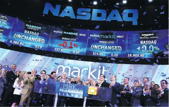  ?? SPENCER PLATT/GETTY IMAGES ?? Markit staff and CEO Lance Uggla, centre, celebrate during the launch of the company’s 2014 IPO in New York City. Uggla, a native of Vancouver who has grown the multibilli­on-dollar data business, now IHS Markit, from London, says innovating within Canada isn’t a problem, but Canada doesn’t compare with the greater size of global markets.