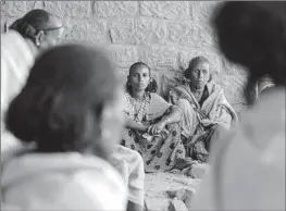  ?? Amir Aman Kiyaro Associated Press ?? ETHIOPIAN women, faces etched with worry over their malnourish­ed children, gather in February at a community meeting in Mai Mekden in the Tigray region.