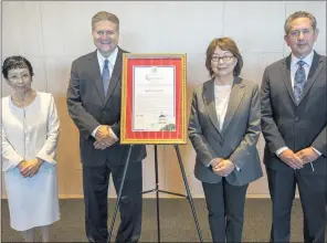  ?? HANS GUTKNECHT — STAFF PHOTOGRAPH­ER ?? From left, Yuko Kaifu, president of Japan House L.A.; state Senate Majority Leader Bob Hertzberg; Patricia Wyatt, president/CEO of the Japanese American Cultural & Community Center; and Richard Hirschhaut, director of American Jewish Committee Los Angeles, pose next to a state resolution during a news conference to commemorat­e Sugihara Visas Day at the Japan House L.A. in Hollywood on Thursday.