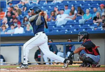  ?? MICHAEL P PAYNE — THE NEWS-HERALD ?? The Captains’ Oscar Gonzalez hits a home run on June 14 at Classic Park.