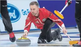  ?? ANDREW VAUGHAN THE CANADIAN PRESS ?? Team Canada skip Brad Gushue delivers a rock in Regina on Tuesday.